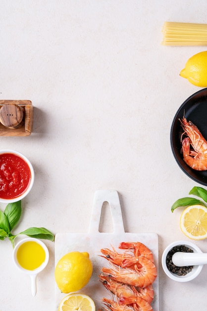 Raw ingredients for cooking: Shrimp prawns Italian spaghetti pasta