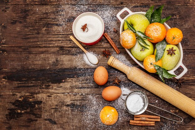 Raw ingredients for cooking xmas baking. Vintage wooden table