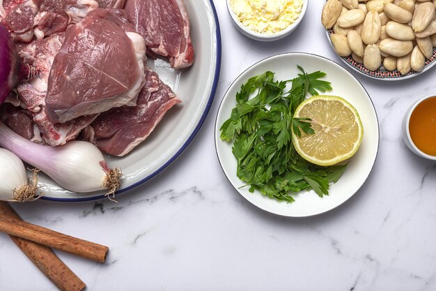 Raw ingredients and spices of traditional lamb stew or tagine