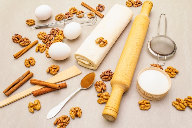 Photo raw ingredients for walnut pie. baking concept cooking on stone surface.