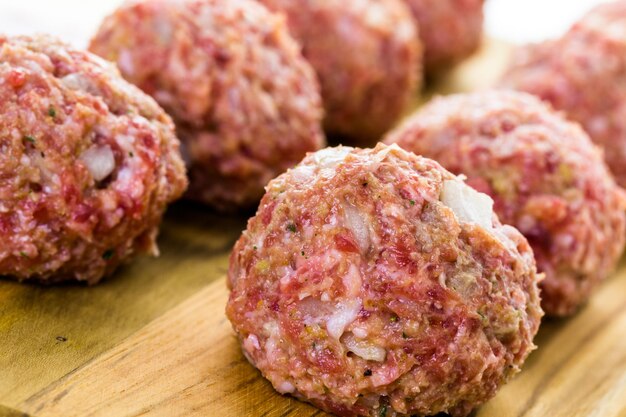 Raw Italian meatballs ready to be cooked for dinner.
