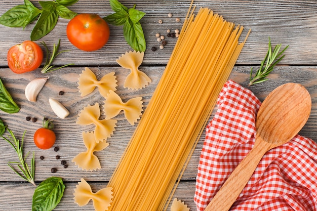 Raw Italian pasta with tomato sauce ingredients