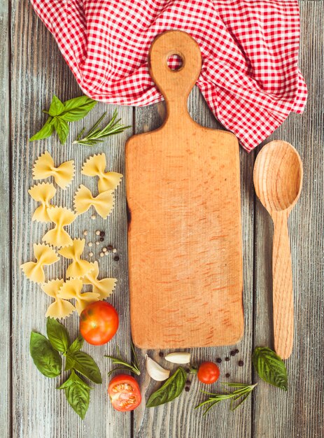 Raw Italian pasta with tomato sauce ingredients