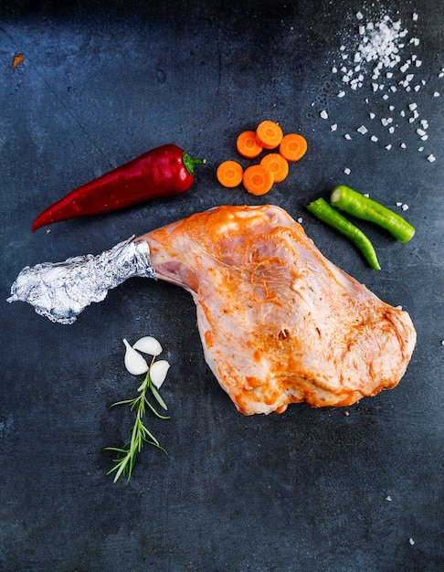 Raw kebab meat on dark background