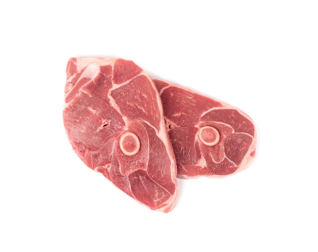 Raw lamb chops isolated top view
