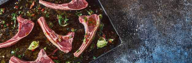 Raw lamb chops on table