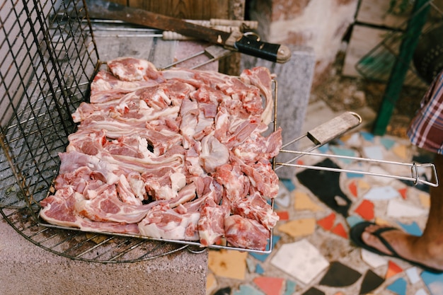 Raw lamb ribs in the grill grill