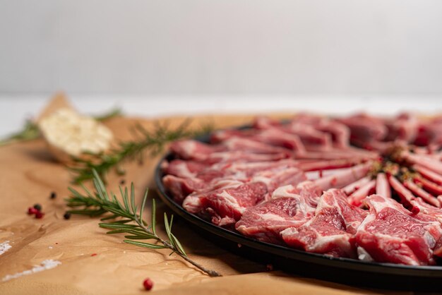 Raw lamb ribs with garlic and rosemary