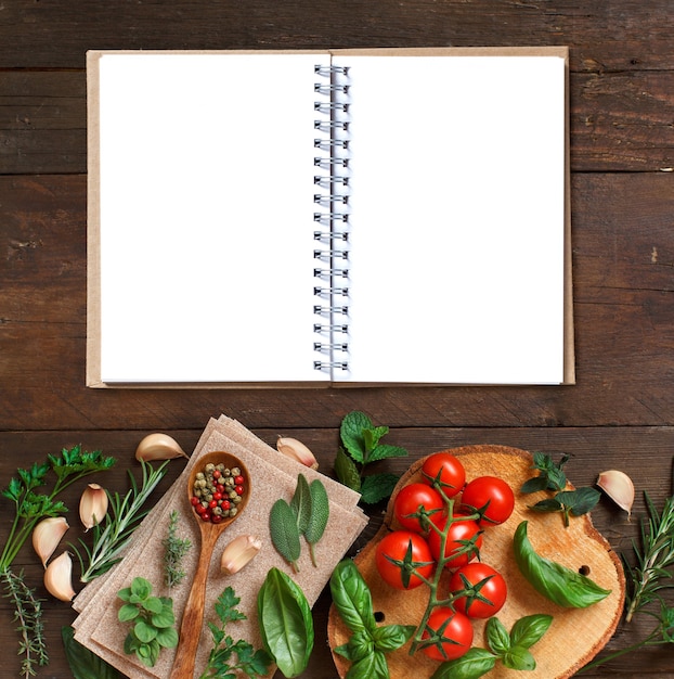 Raw lasagna pasta, vegetables and herbs on a wooden surface