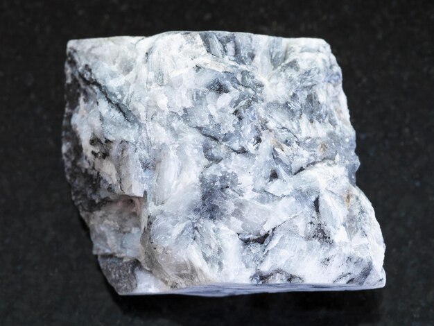 Raw magnesite stone on dark background