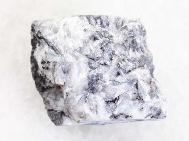 Raw magnesite stone on white marble