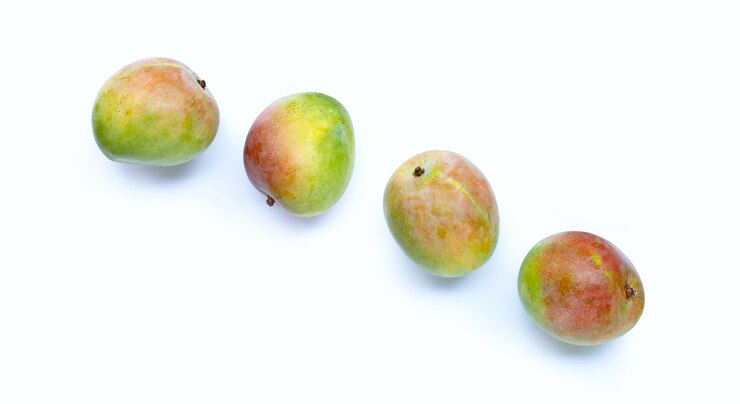Photo raw mango on white background. top view