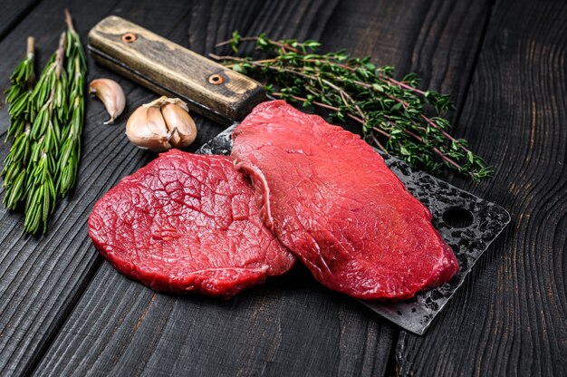 Raw marble beef meat fillet steak on butcher cleaver