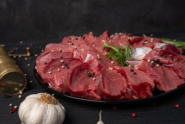 Raw meat on black background