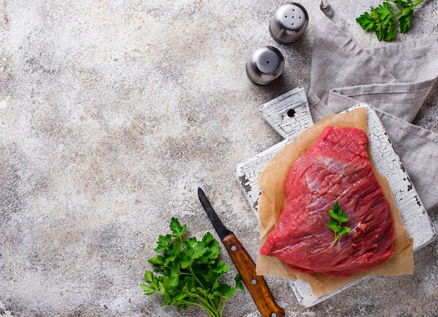 Raw meat on cutting board