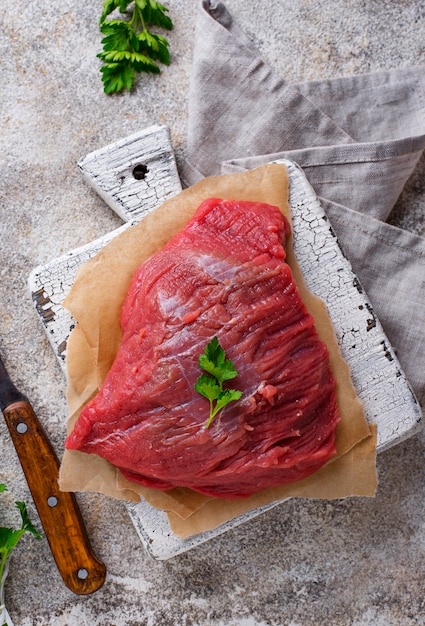 Raw meat on cutting board