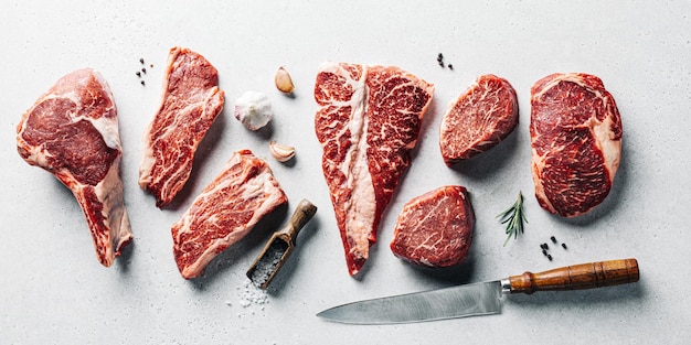 Raw meat fillet for different steak kind preparation top view butcher shop set