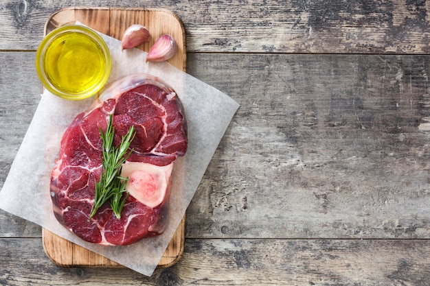 Raw meat fillet on wood with copy space