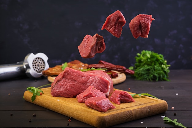 Raw meat. Fresh beef on wooden background