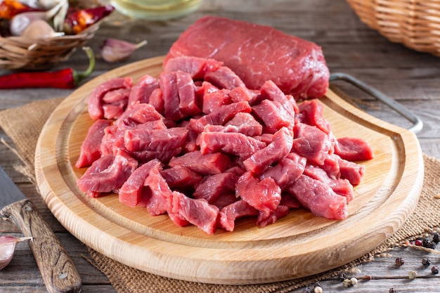 Raw meat, raw beef on a cutting board on a table