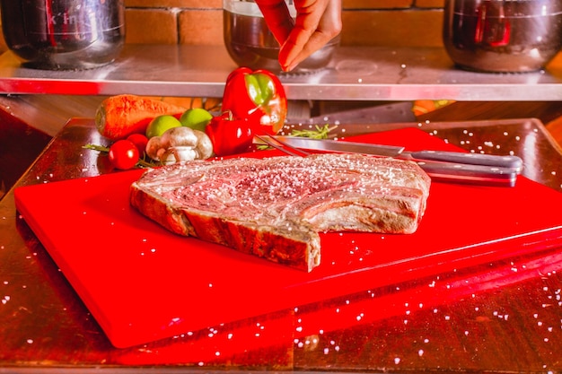 RAW MEAT READY TO GRILL ON A TABLE