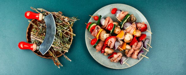 Raw meat skewers with vegetables