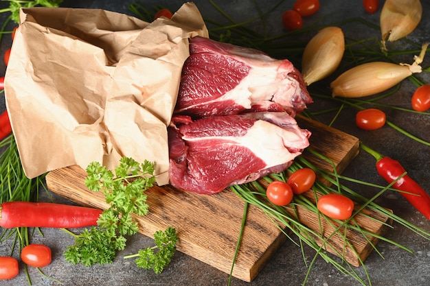 Raw meat with ingredients for cooking, top view