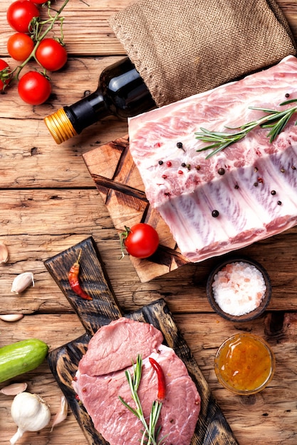 Raw meat on wooden board