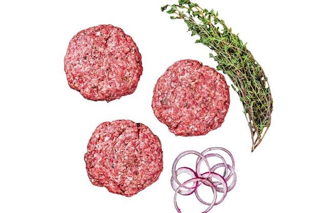Raw minced beef cutlets with spices and herbs ready for cooking Isolated white background