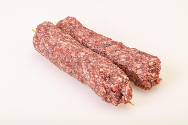 Raw minced beef kebab skewer