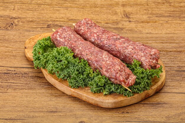 Raw minced beef kebab skewer