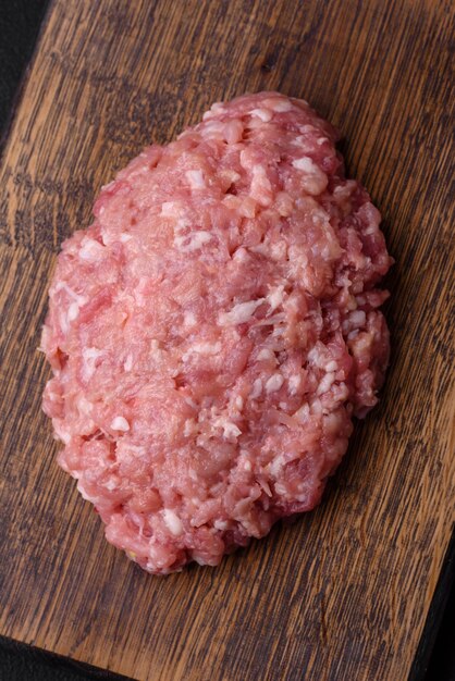 Raw minced beef pork or chicken meat with salt spices and herbs
