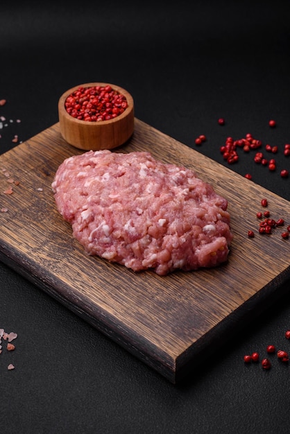 Raw minced beef pork or chicken meat with salt spices and herbs