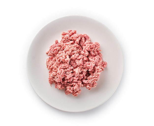 Photo raw minced meat on the white plate fresh pork minced meat on white background raw minced pork