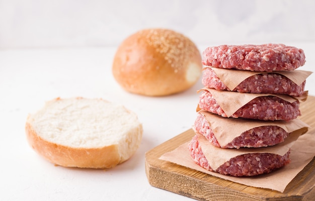 Raw minced meat on wooden board