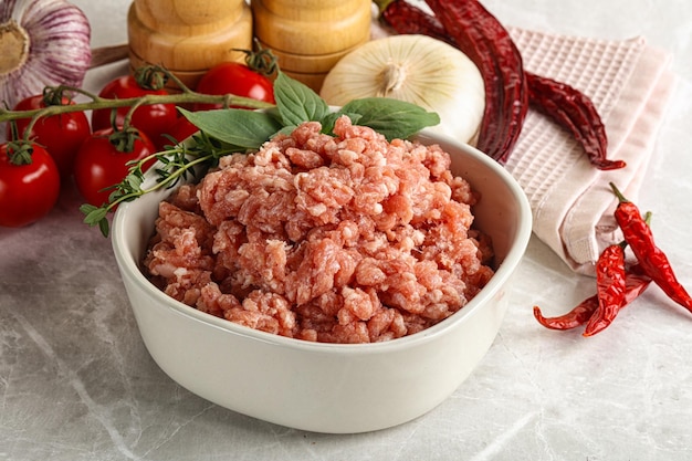 Raw minced pork uncooked meat in the bowl