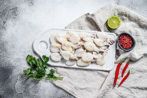 Raw mini cuttlefish on a table