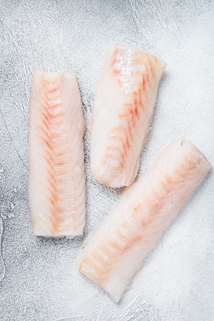 Raw Norwegian cod fish fillet on kitchen table