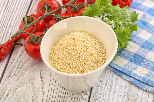 Raw organic sesame seeds in the bowl for cooking