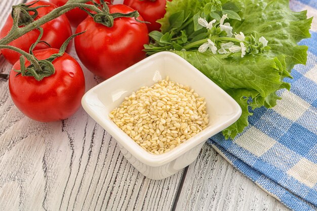 Raw organic sesame seeds in the bowl for cooking