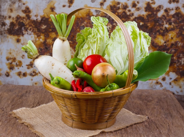 Raw organic vegetables on old wooden table