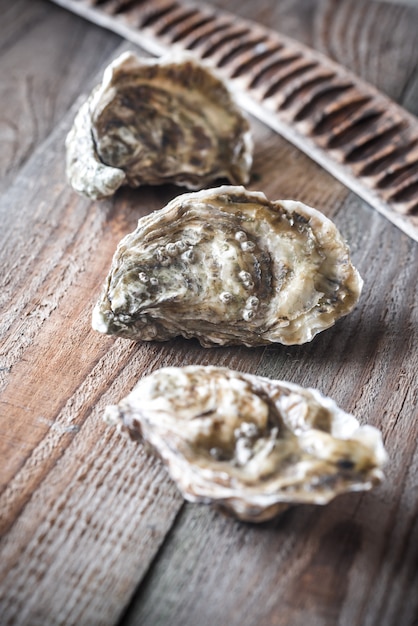 Raw oysters on the wooden table