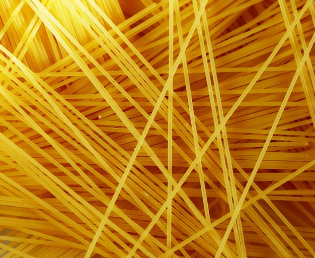 Photo raw pasta as whole background