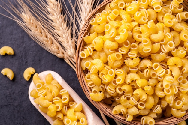 Raw pasta in bowl