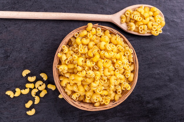 Raw pasta in bowl