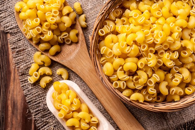 Raw pasta in bowl