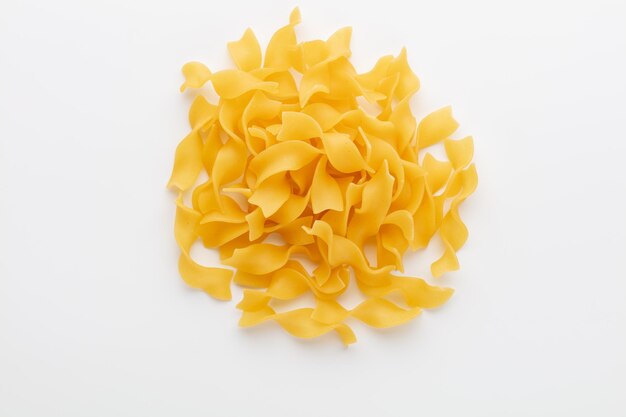 Raw pasta isolated on white background.