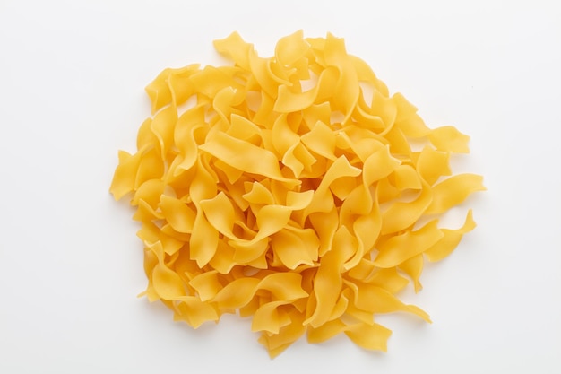 Raw pasta isolated on white background