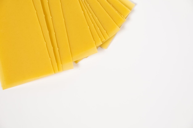 Raw pasta for lasagna on white background