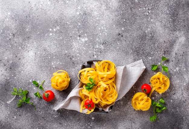 Raw pasta tagliatelle or fettuccine